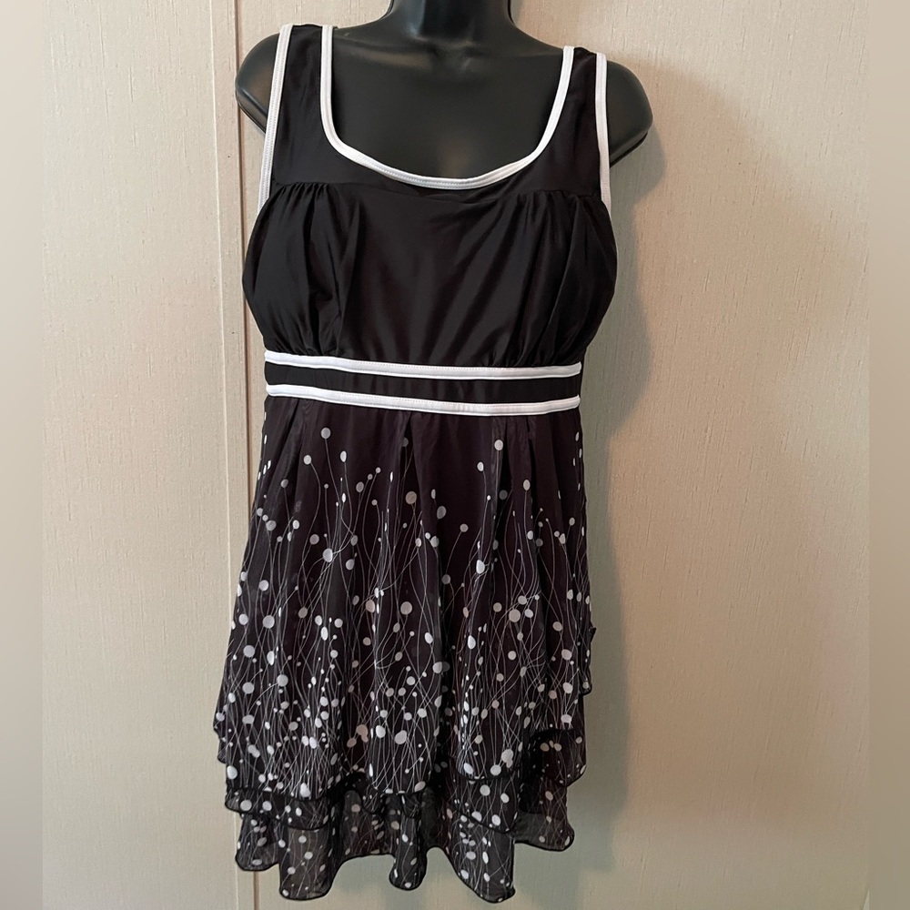 Dynamic Black and White Swimwear with Ruffled Skirt and Black Shorts